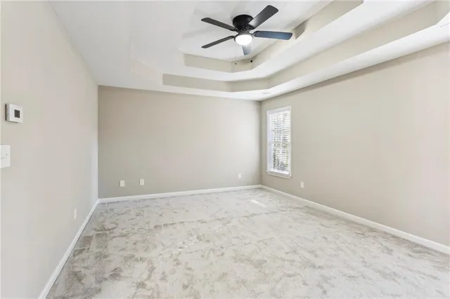 a white bath tub sitting under a bathroom