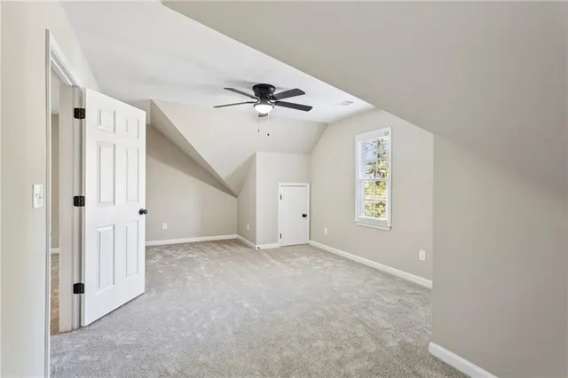 a balcony with wooden floor and fence