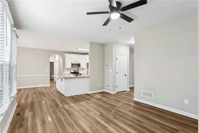a view of a kitchen and a sink dishwasher with wooden floor