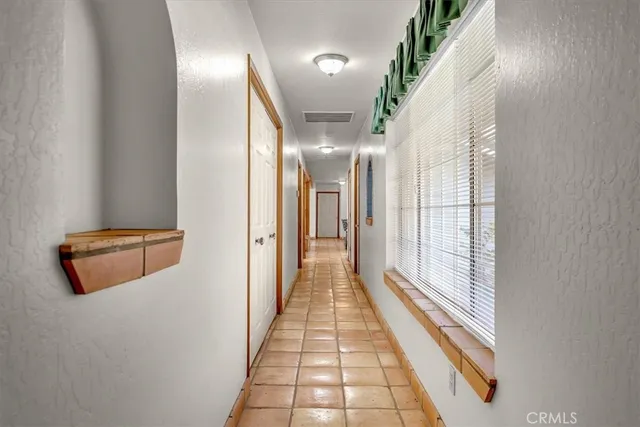 a bathroom with a sink a vanity and a mirror