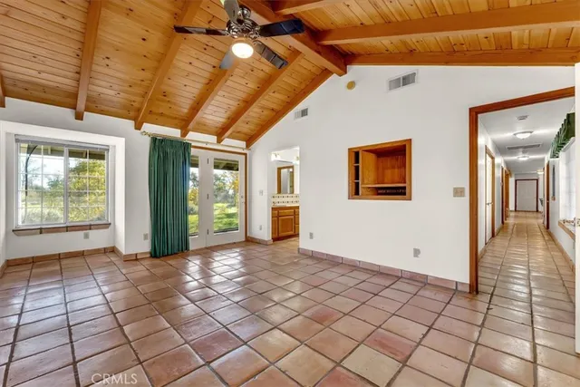 a bathroom with a shower and a glass door