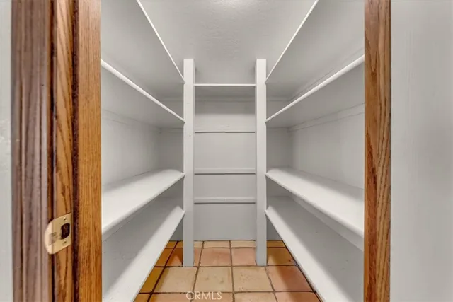 a view of a backyard with plants and patio