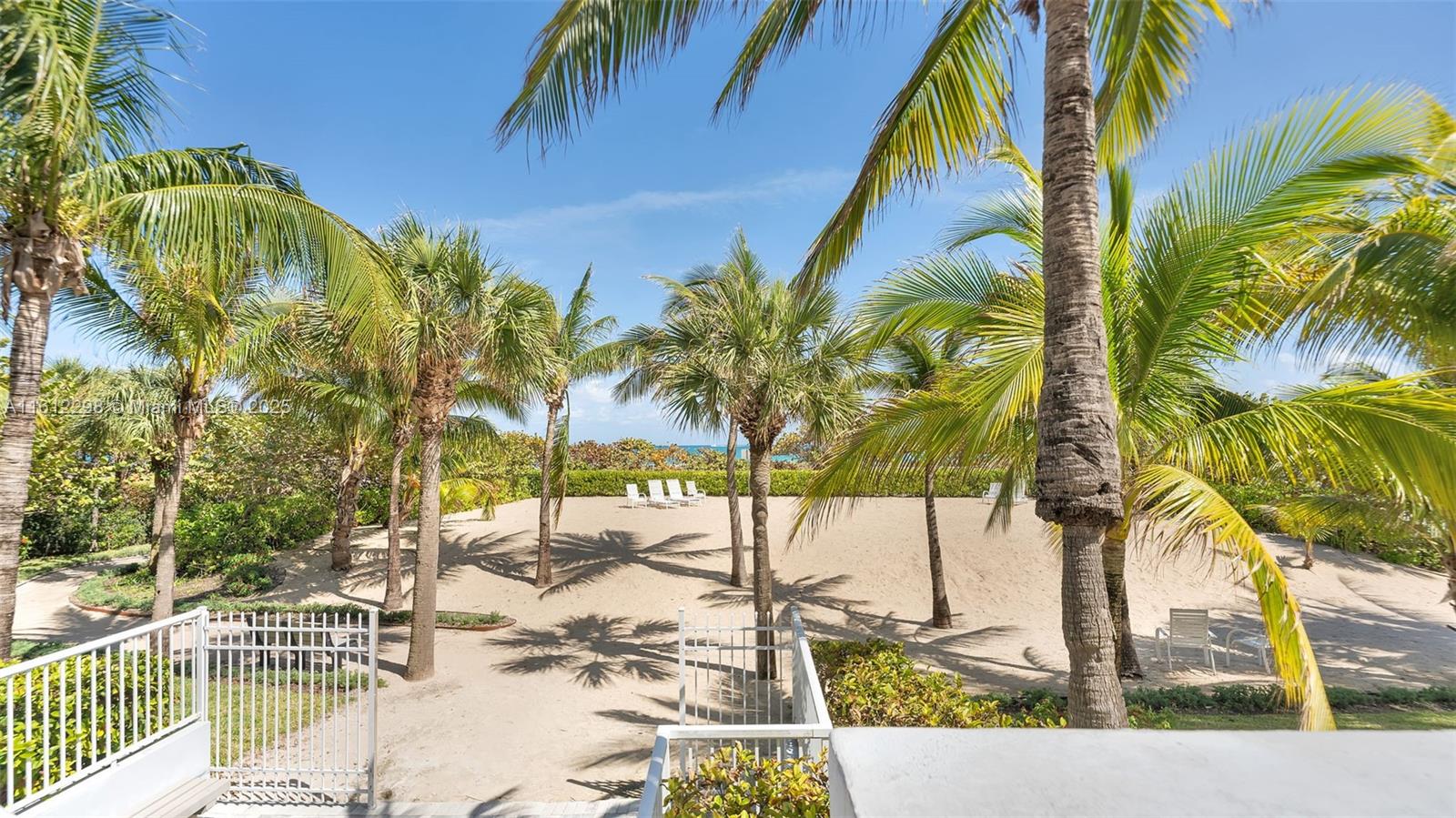 9341 Collins Avenue, Unit 707 Surfside, FL 33154 - Photo 24 of 55 a view of a palm trees front of the house