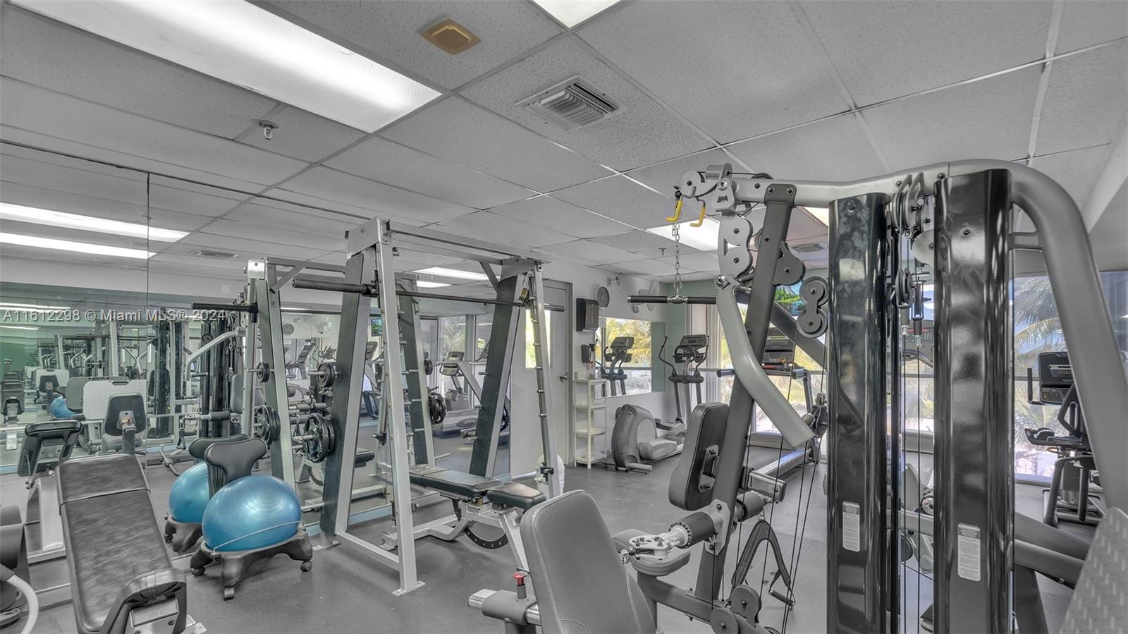 9341 Collins Avenue, Unit 707 Surfside, FL 33154 - Photo 26 of 55 a view of a room with gym equipment