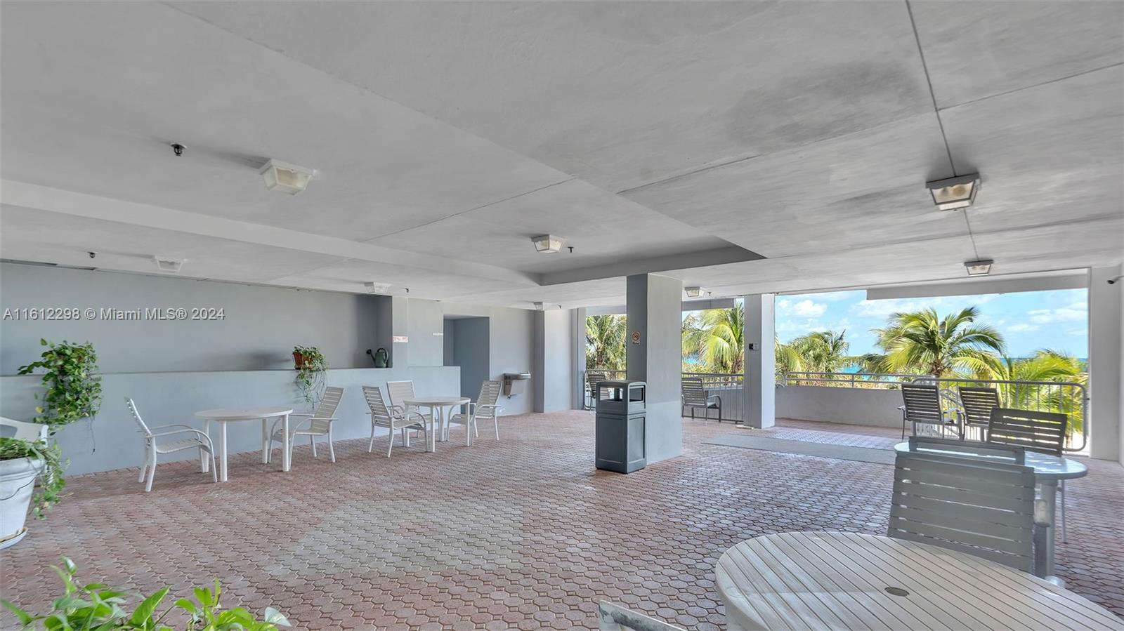 9341 Collins Avenue, Unit 707 Surfside, FL 33154 - Photo 50 of 55 a living room with furniture and a large window