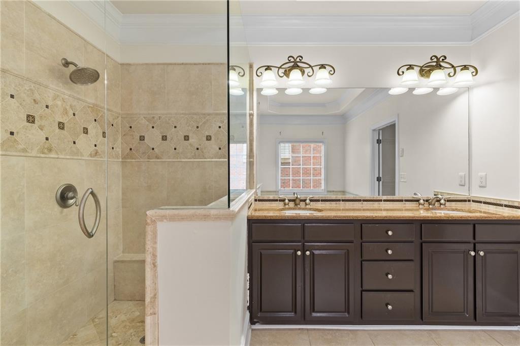 5765 Bailey Ridge Court Johns Creek, GA 30097 - Photo 28 of 51 a bathroom with a double vanity sink mirror and