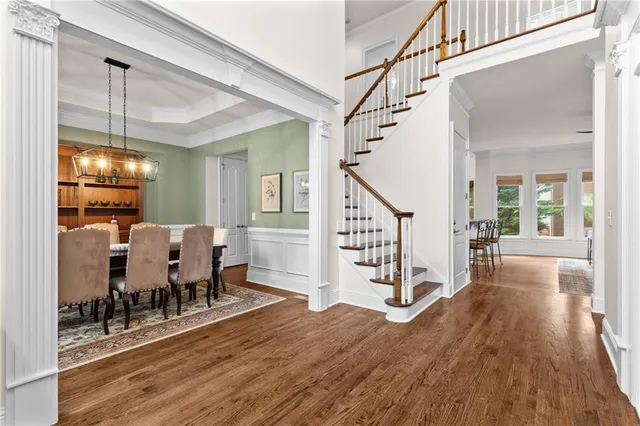 a view of a livingroom with furniture and hardwood floor