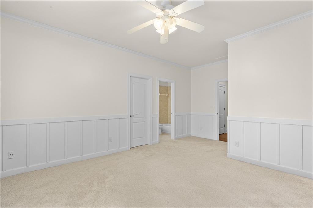 5765 Bailey Ridge Court Johns Creek, GA 30097 - Photo 33 of 51 an empty room with fan and entrance