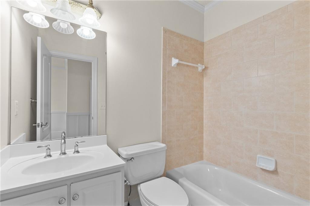 5765 Bailey Ridge Court Johns Creek, GA 30097 - Photo 34 of 51 a bathroom with a sink a toilet and shower