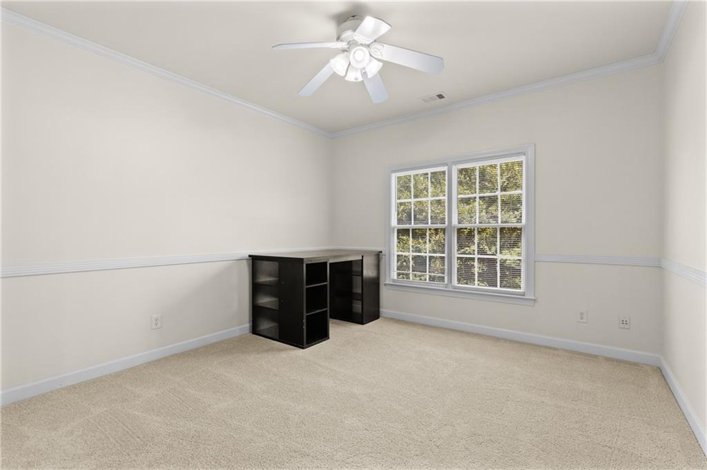 5765 Bailey Ridge Court Johns Creek, GA 30097 - Photo 35 of 51 an empty room with a window and a ceiling fan