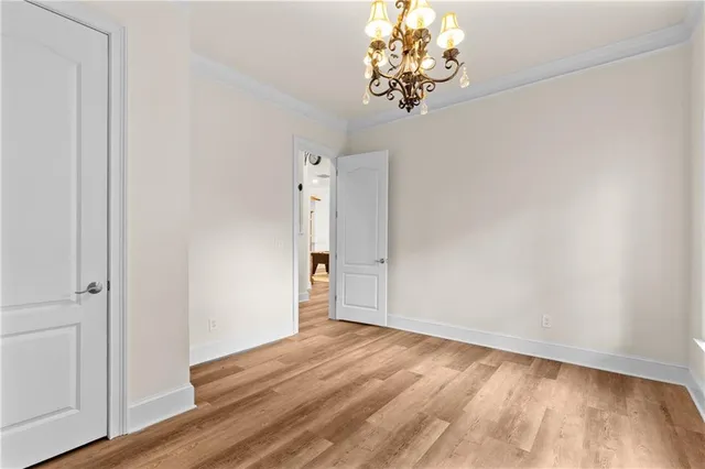 a bathroom with a granite countertop sink a toilet a mirror and shower