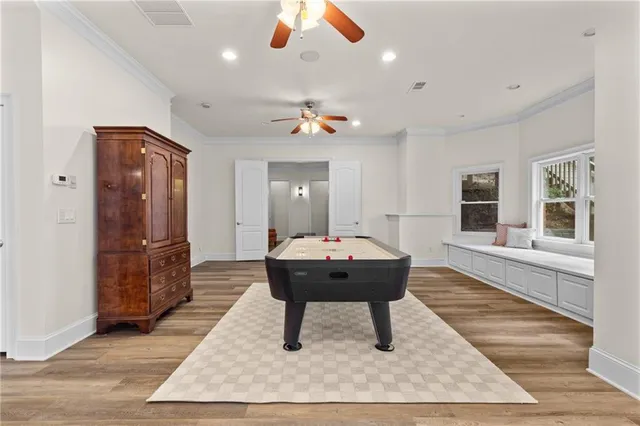 a living room with furniture and a chair