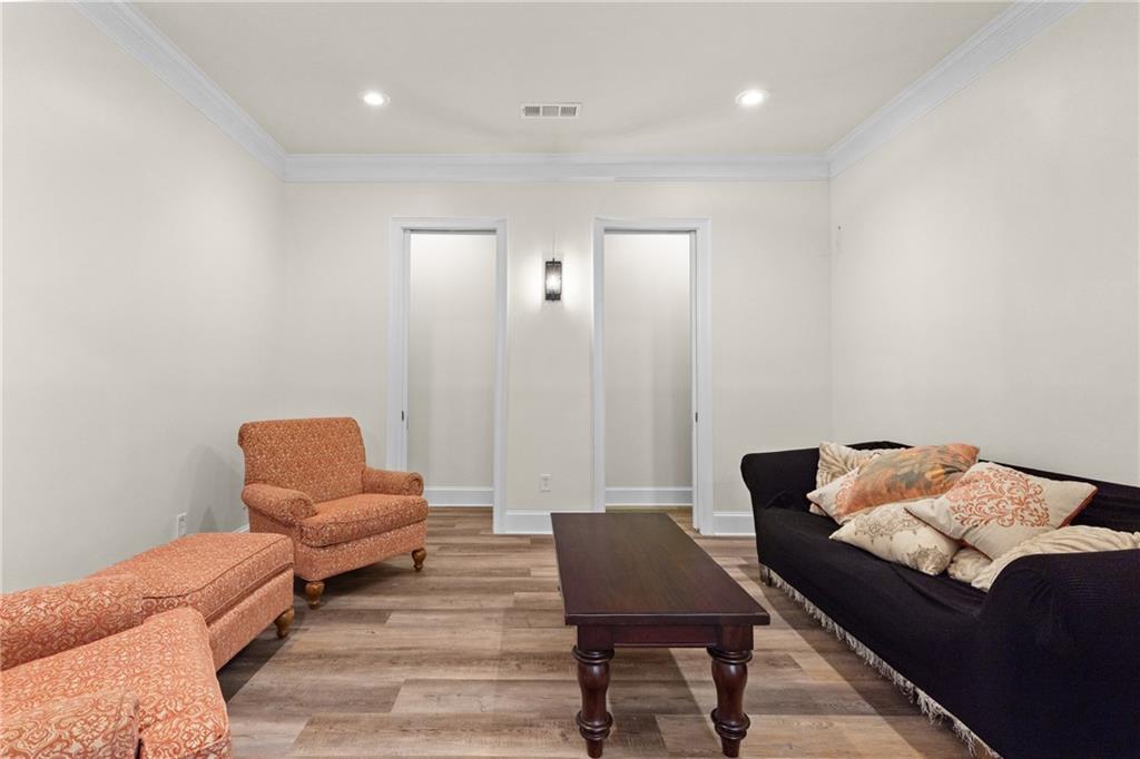 5765 Bailey Ridge Court Johns Creek, GA 30097 - Photo 48 of 51 a living room with furniture and a chair