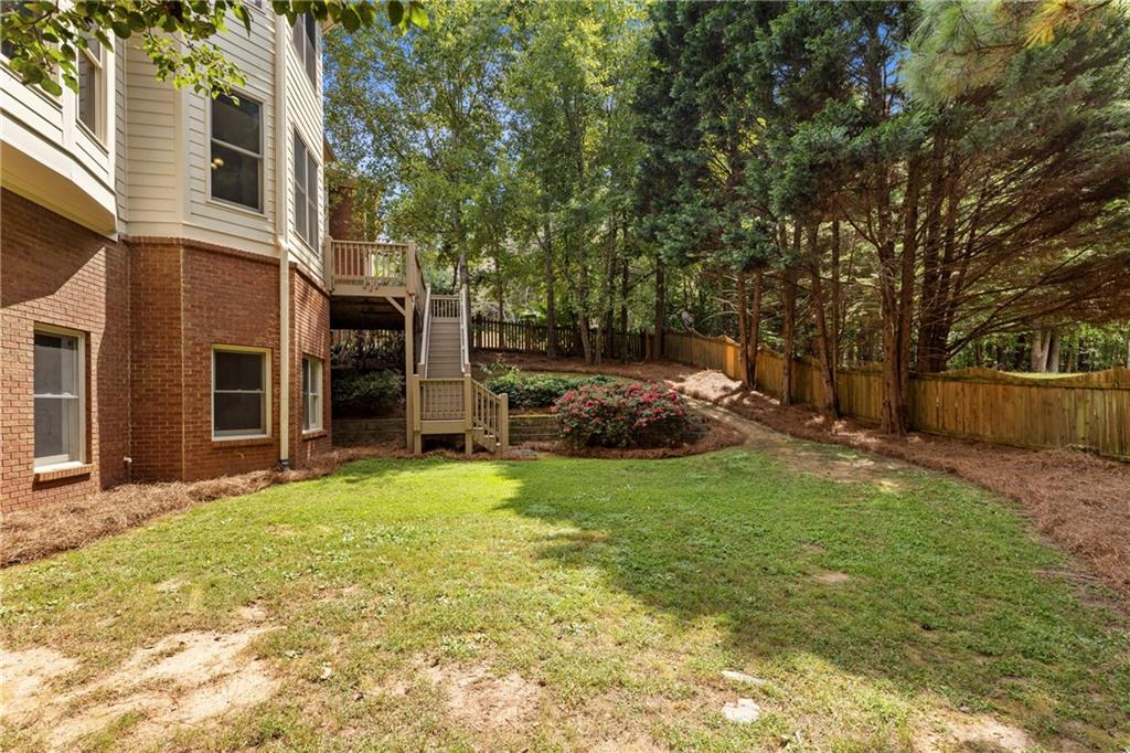 5765 Bailey Ridge Court Johns Creek, GA 30097 - Photo 51 of 51 a backyard of a house with barbeque oven