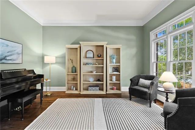 a living room with furniture and a piano