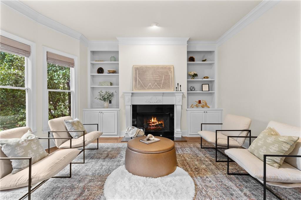 5765 Bailey Ridge Court Johns Creek, GA 30097 - Photo 7 of 51 a living room with furniture and a fireplace