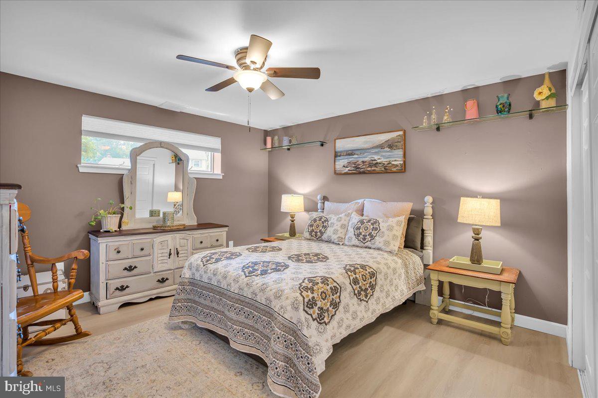 32 Millbridge Road Clementon, NJ 08021 - Photo 12 of 21 a bedroom with a bed and a chandelier