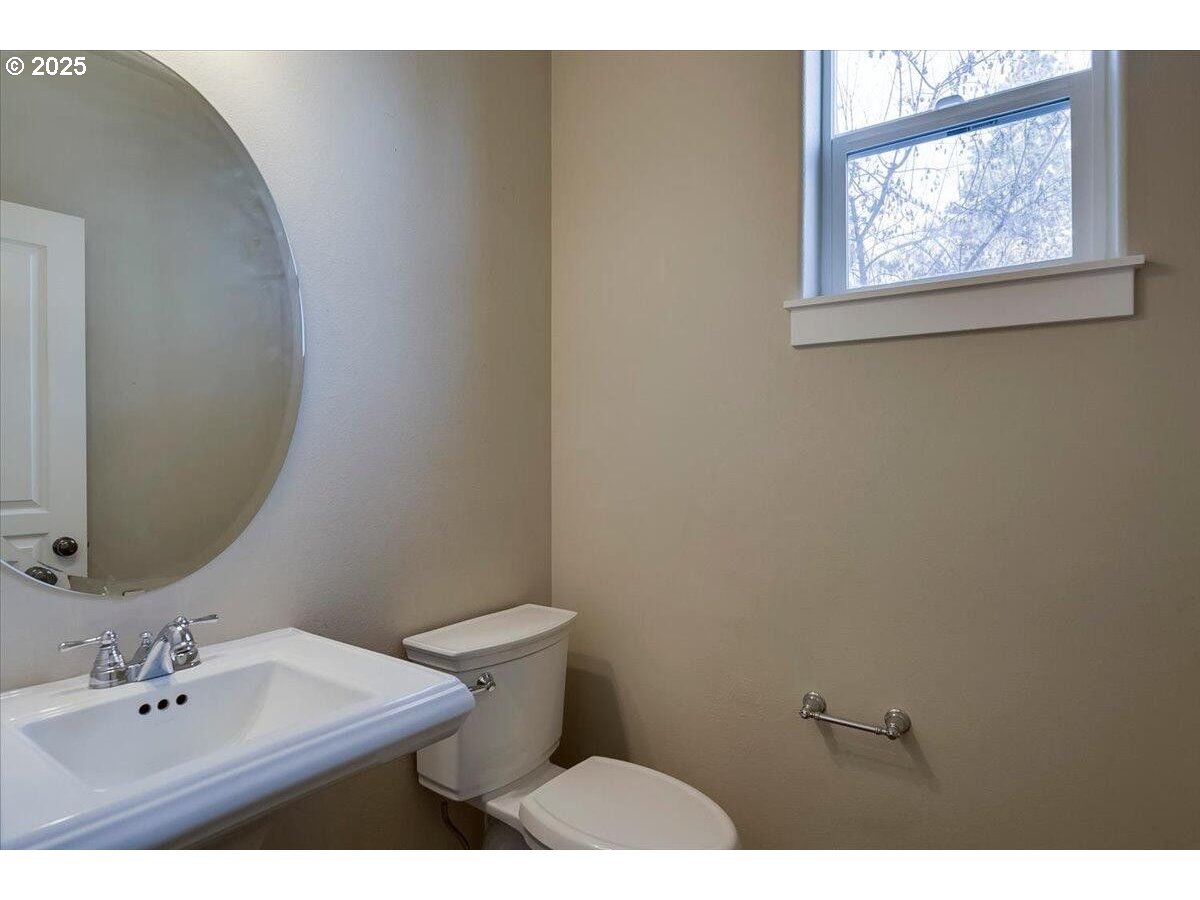 20370 Murphy Road Bend, OR 97702 - Photo 11 of 30 a bathroom with a sink mirror and toilet