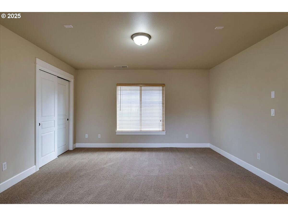 20370 Murphy Road Bend, OR 97702 - Photo 12 of 30 a view of an empty room with a window