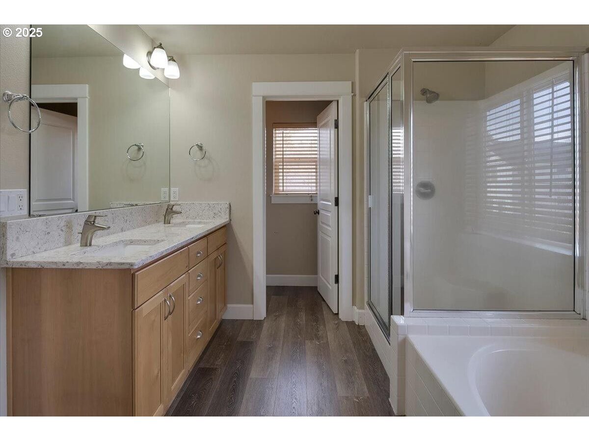 20370 Murphy Road Bend, OR 97702 - Photo 17 of 30 a bathroom with a sink a mirror and a shower