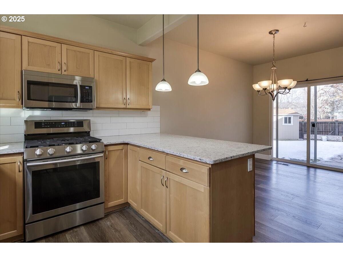 20370 Murphy Road Bend, OR 97702 - Photo 9 of 30 a kitchen with a stove and a microwave