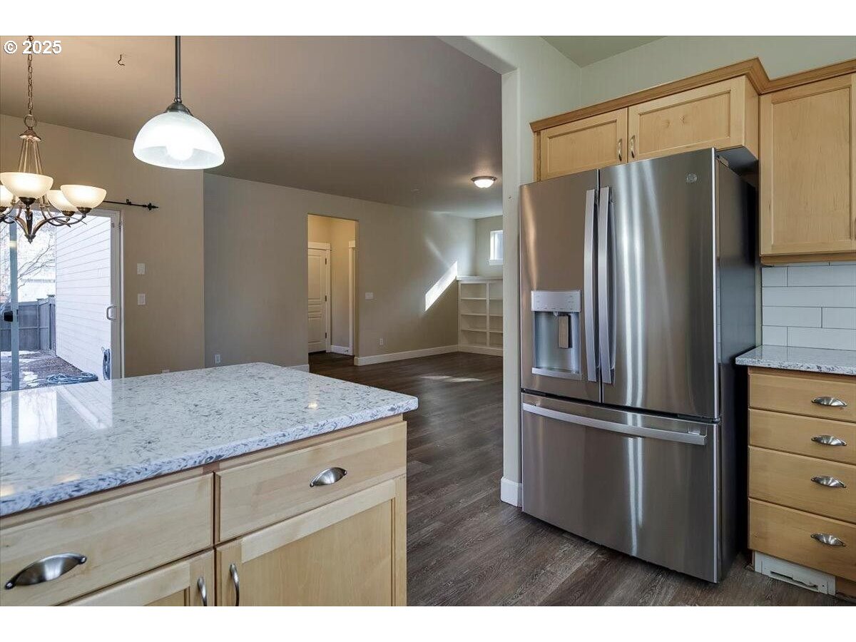20370 Murphy Road Bend, OR 97702 - Photo 10 of 30 a kitchen with stainless steel appliances granite countertop a refrigerator and a sink