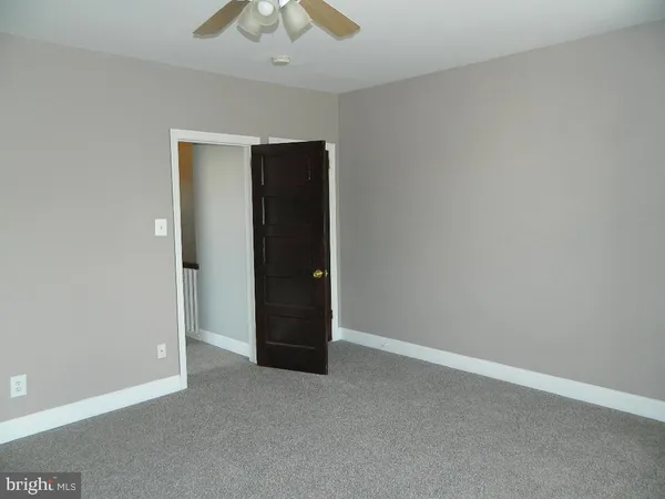 an empty room with a bathroom