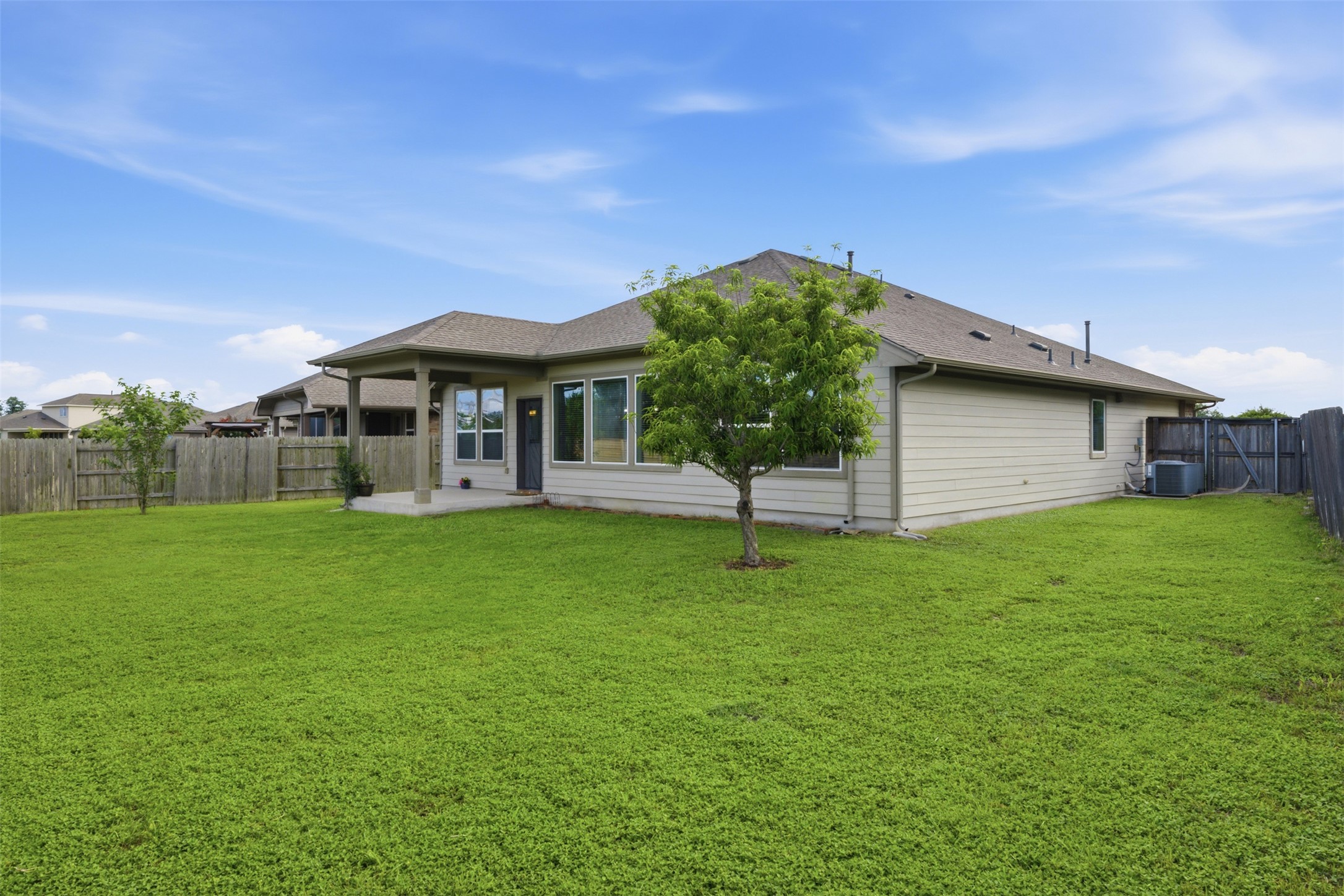 276 Gunnison Way Kyle, TX 78640 - Photo 21 of 28 a backyard of a house with lots of green space