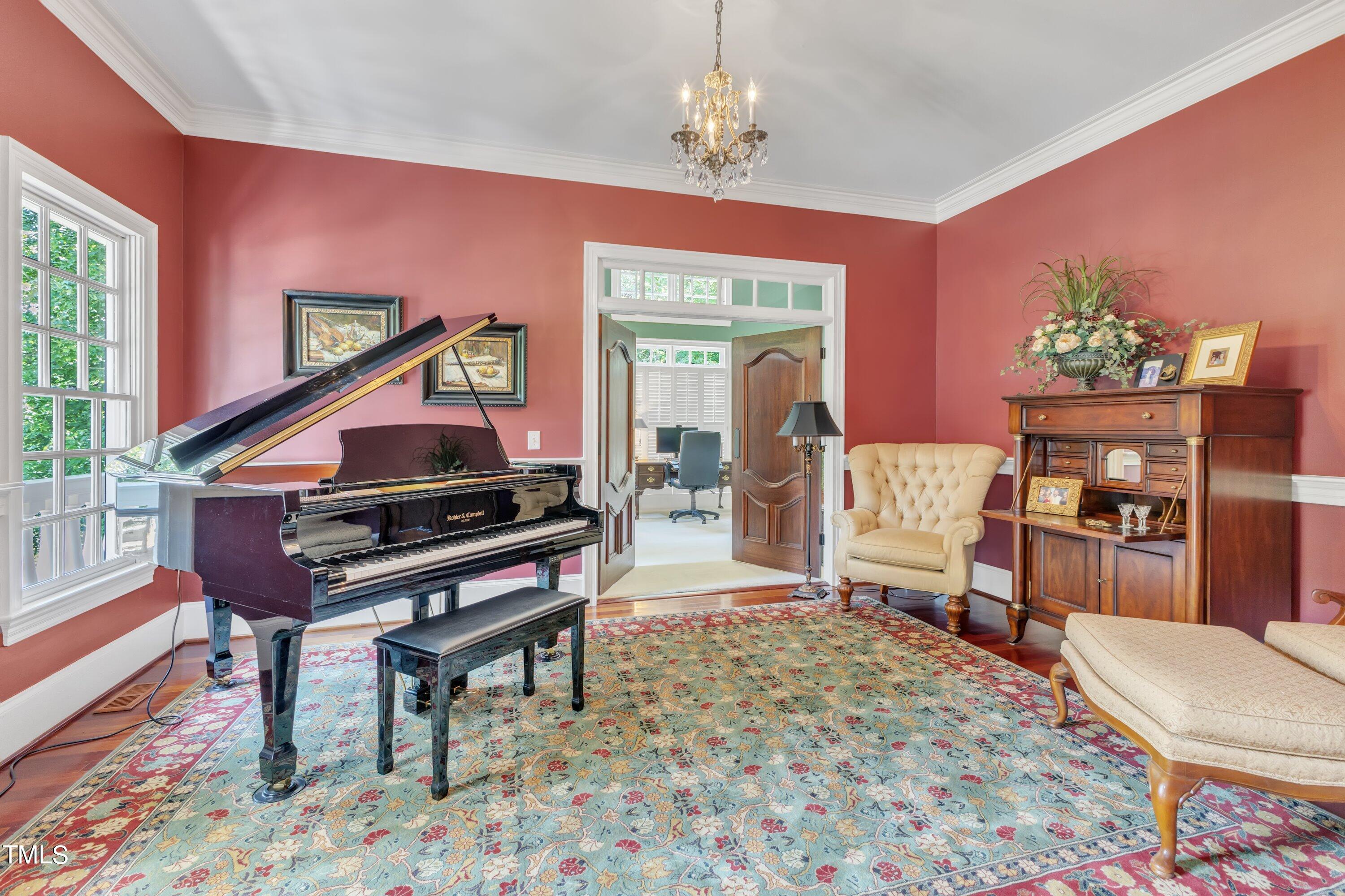 11220 Brass Kettle Road Raleigh, NC 27614 - Photo 11 of 86 a living room with furniture a piano and a potted plant