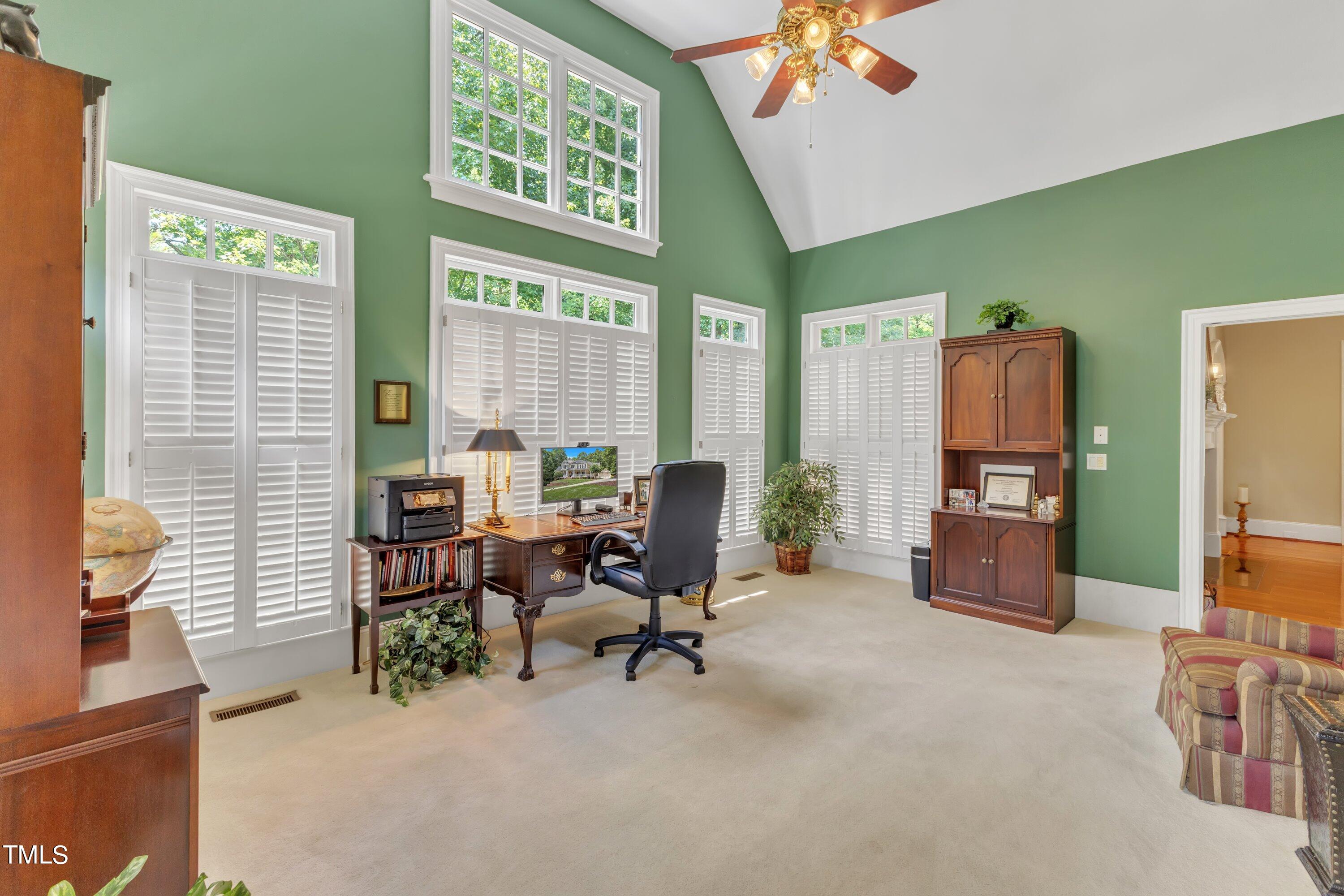 11220 Brass Kettle Road Raleigh, NC 27614 - Photo 13 of 86 a view of a livingroom with workspace and a window