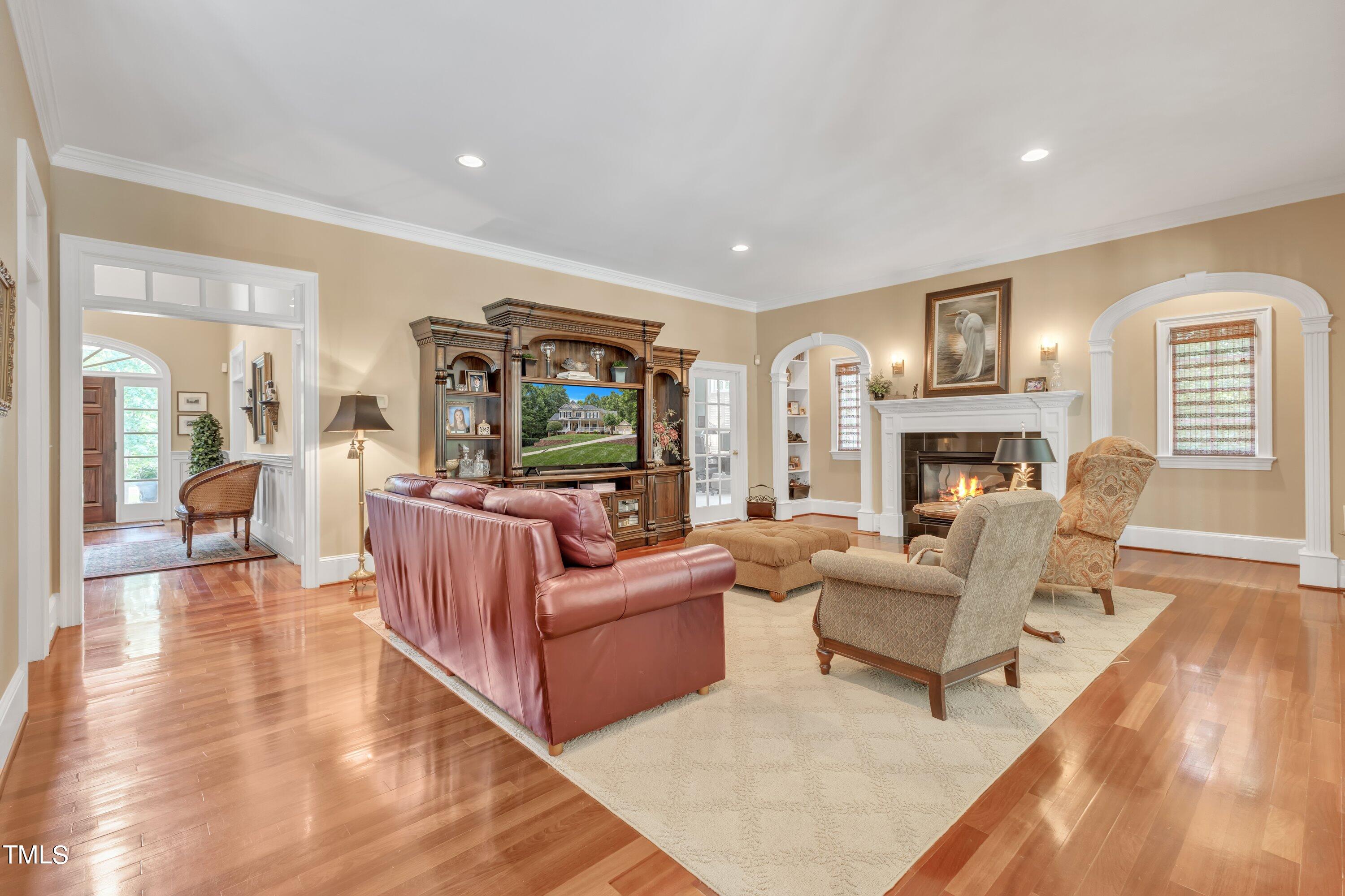 11220 Brass Kettle Road Raleigh, NC 27614 - Photo 17 of 86 a living room with fireplace furniture and a wooden floor