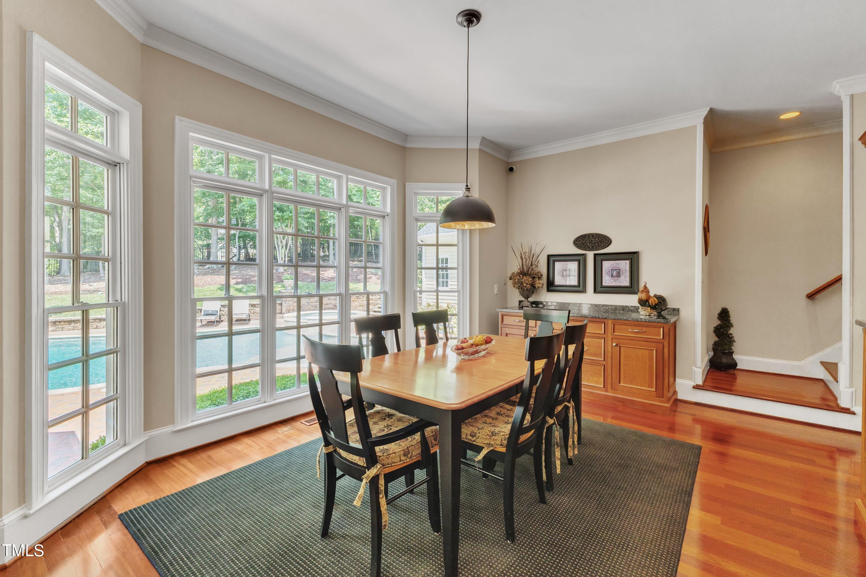 11220 Brass Kettle Road Raleigh, NC 27614 - Photo 25 of 86 a dining room with furniture window wooden floor