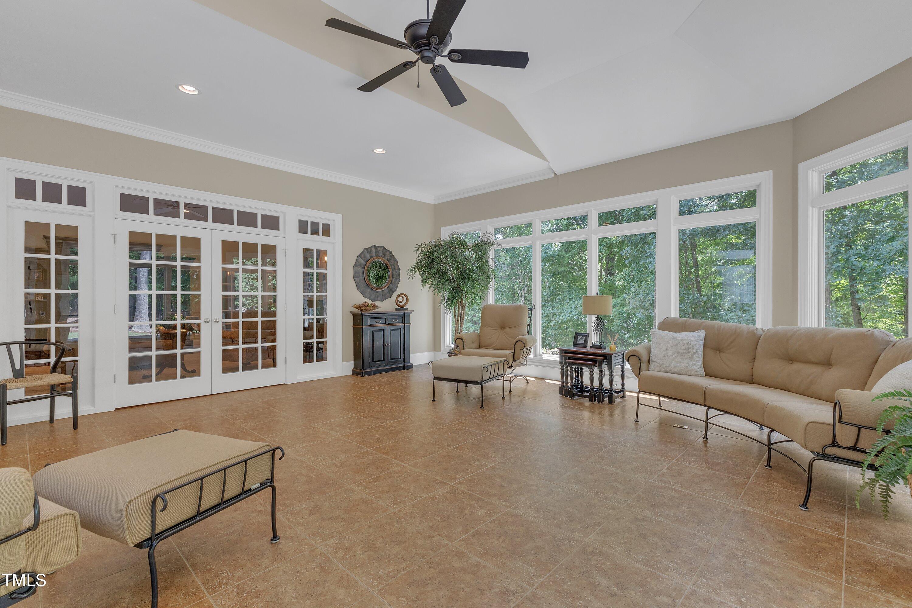 11220 Brass Kettle Road Raleigh, NC 27614 - Photo 26 of 86 a living room with furniture and a large window