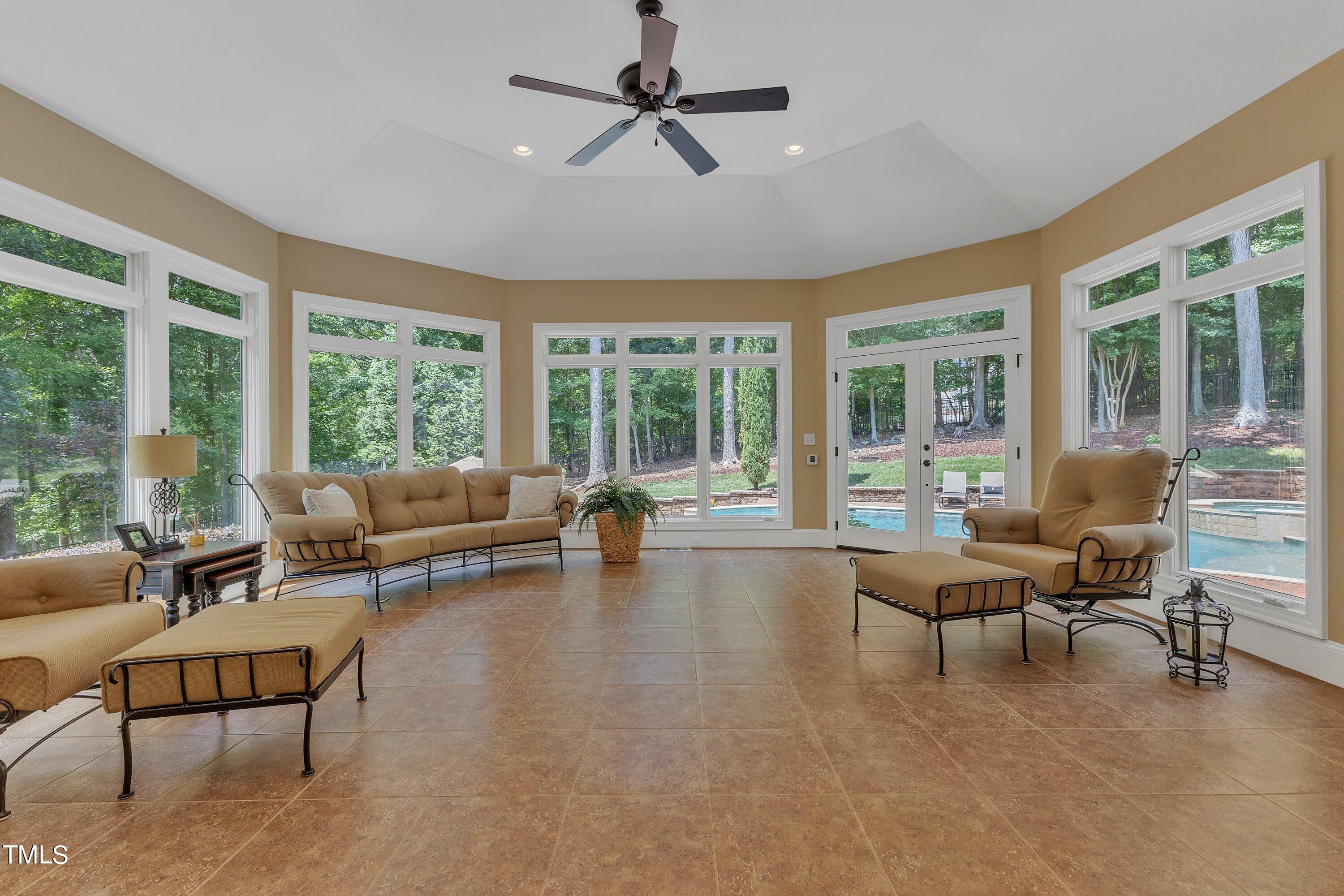 11220 Brass Kettle Road Raleigh, NC 27614 - Photo 29 of 86 a living room with furniture and a large window