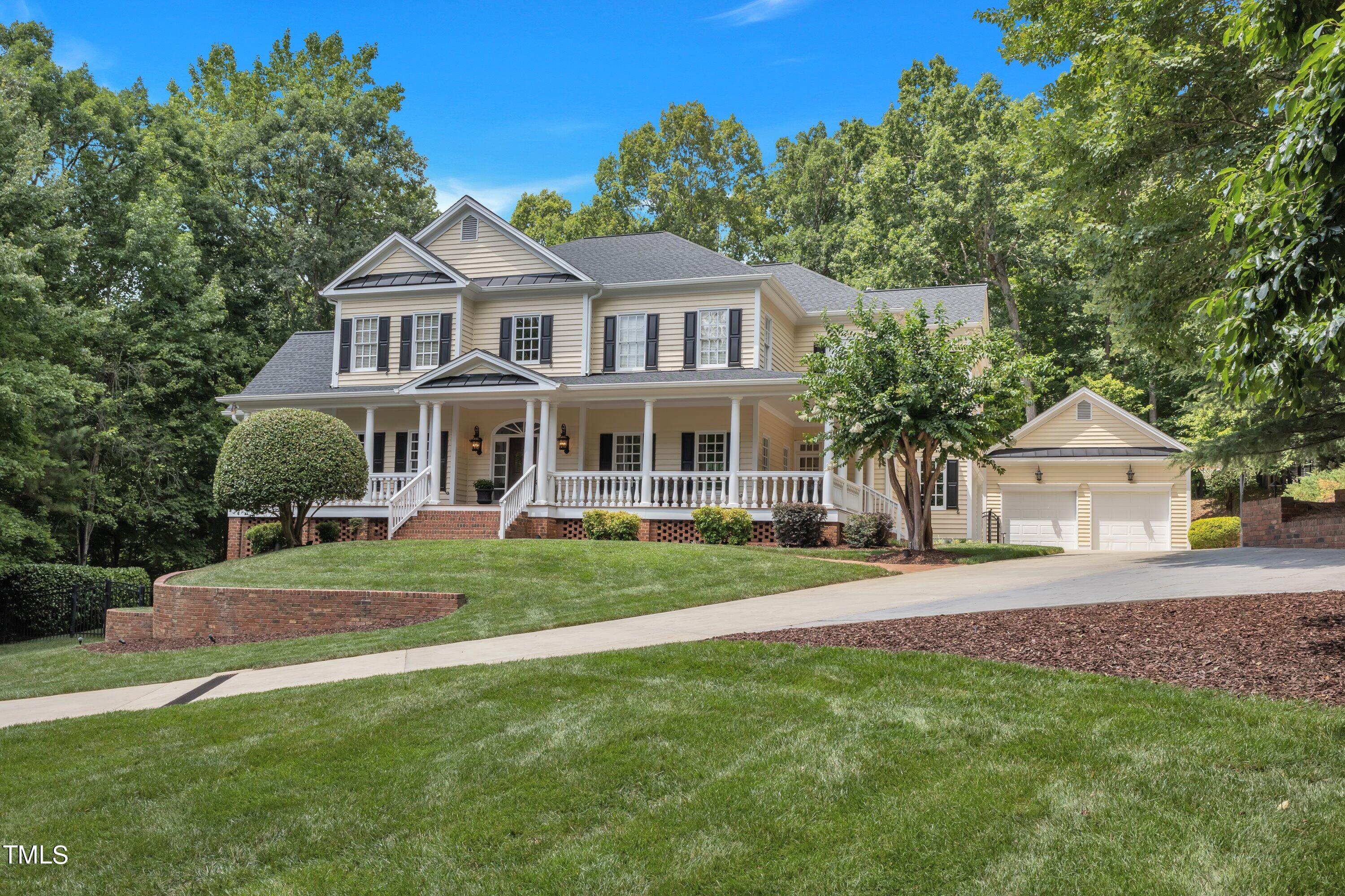 11220 Brass Kettle Road Raleigh, NC 27614 - Photo 3 of 86 a front view of a house with a yard table and chairs