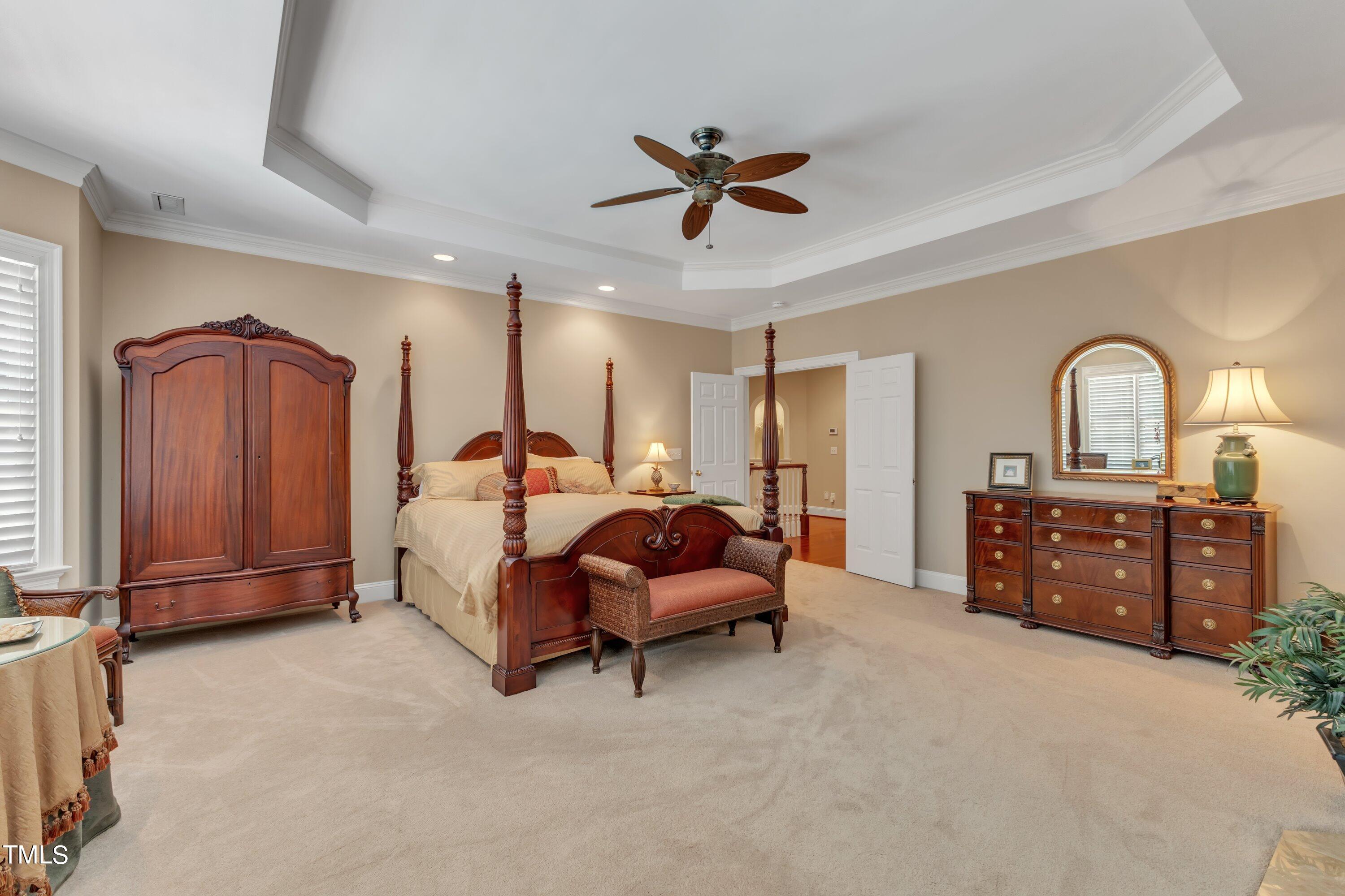 11220 Brass Kettle Road Raleigh, NC 27614 - Photo 43 of 86 a bed room with a bed and a dresser