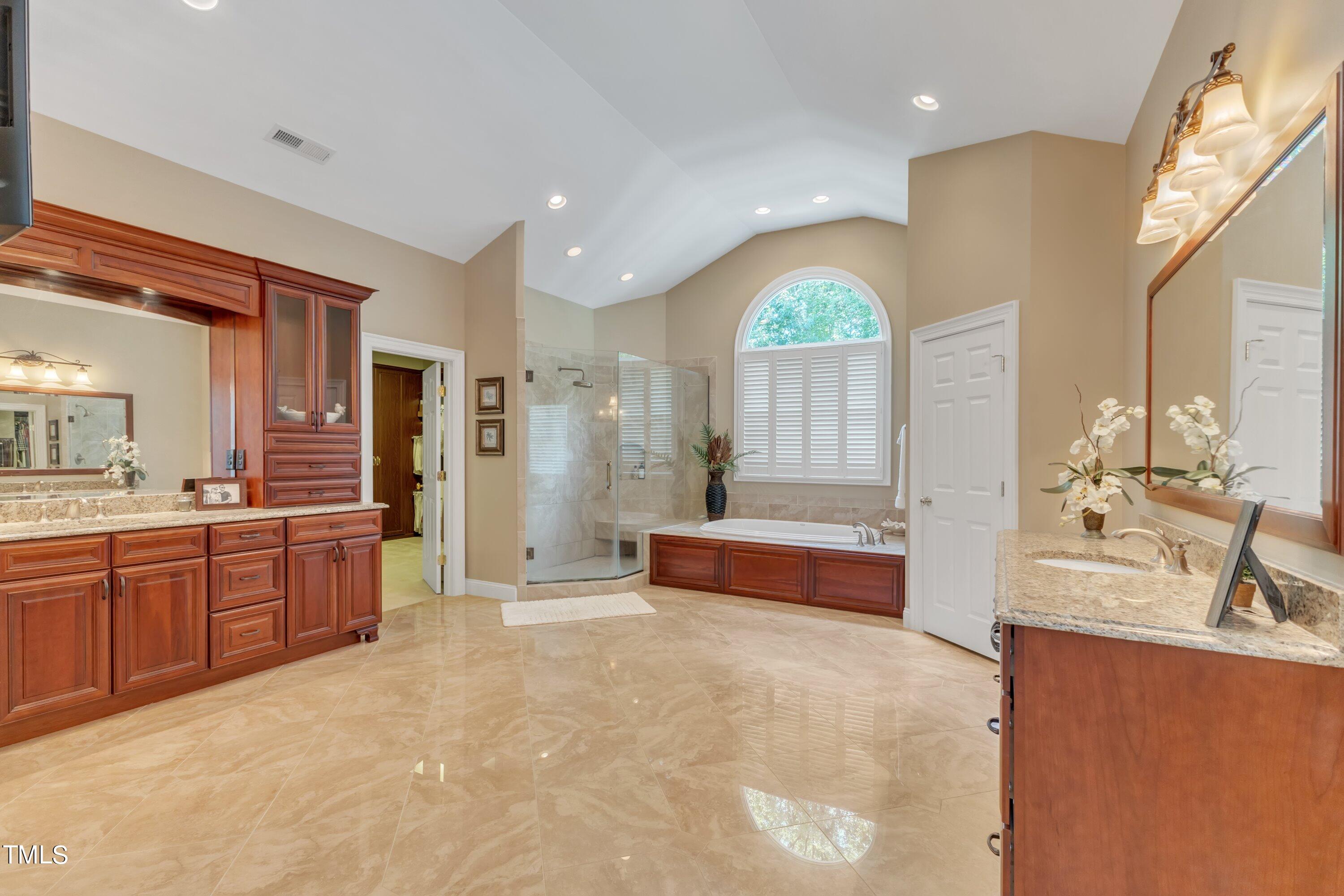 11220 Brass Kettle Road Raleigh, NC 27614 - Photo 46 of 86 a large spacious bathroom with a large tub and sink