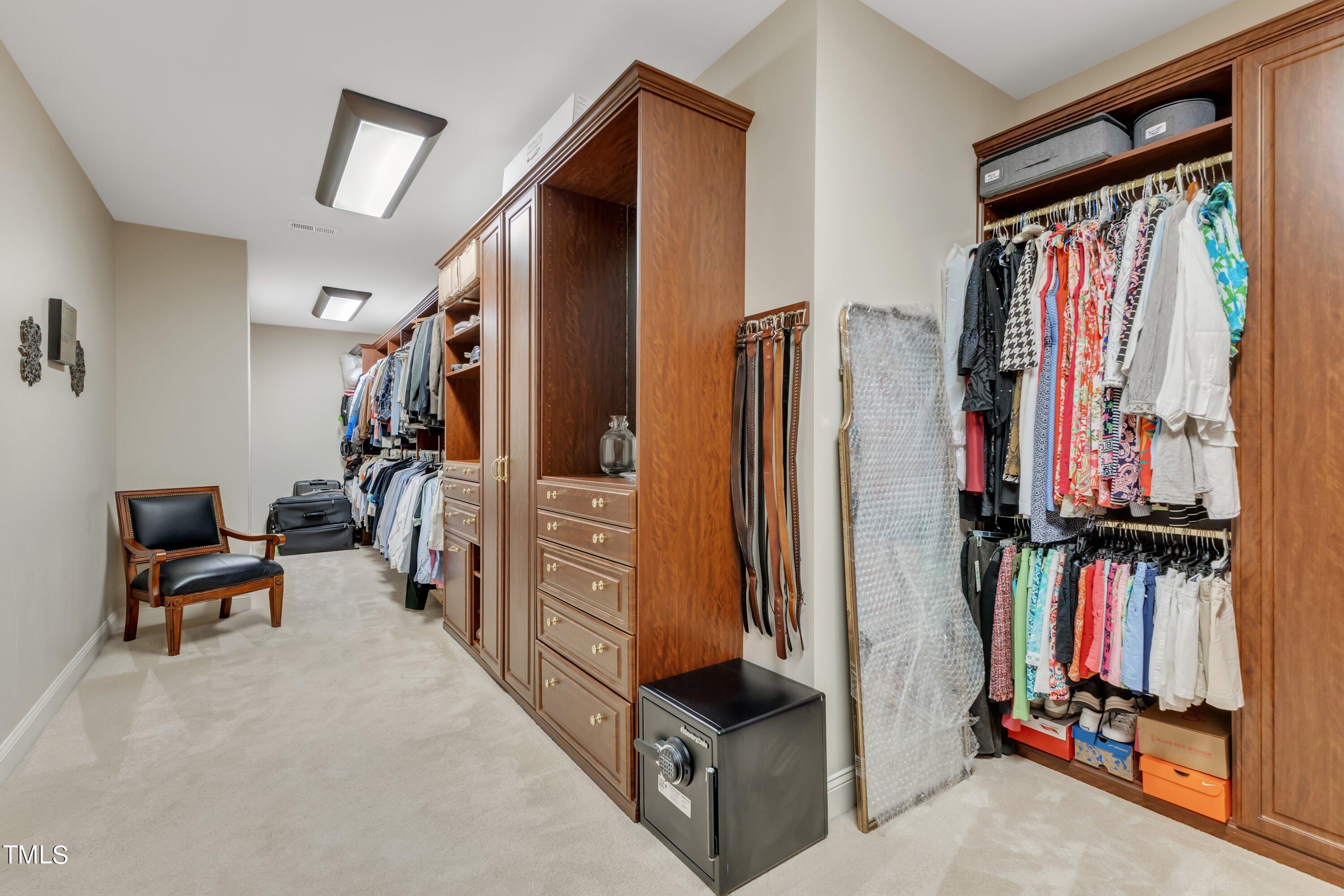 11220 Brass Kettle Road Raleigh, NC 27614 - Photo 50 of 86 a view of walk in closet with clothes and shoes