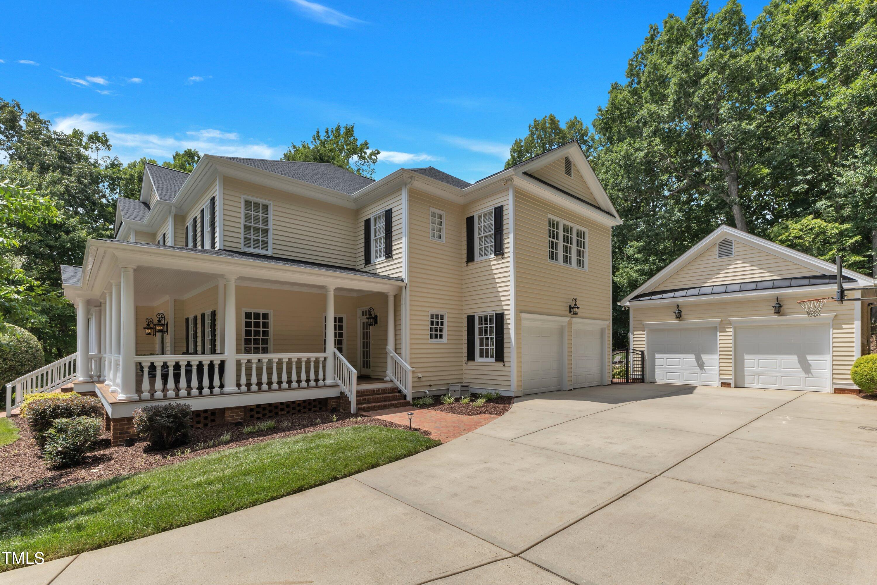 11220 Brass Kettle Road Raleigh, NC 27614 - Photo 66 of 86 a front view of a house with a garden