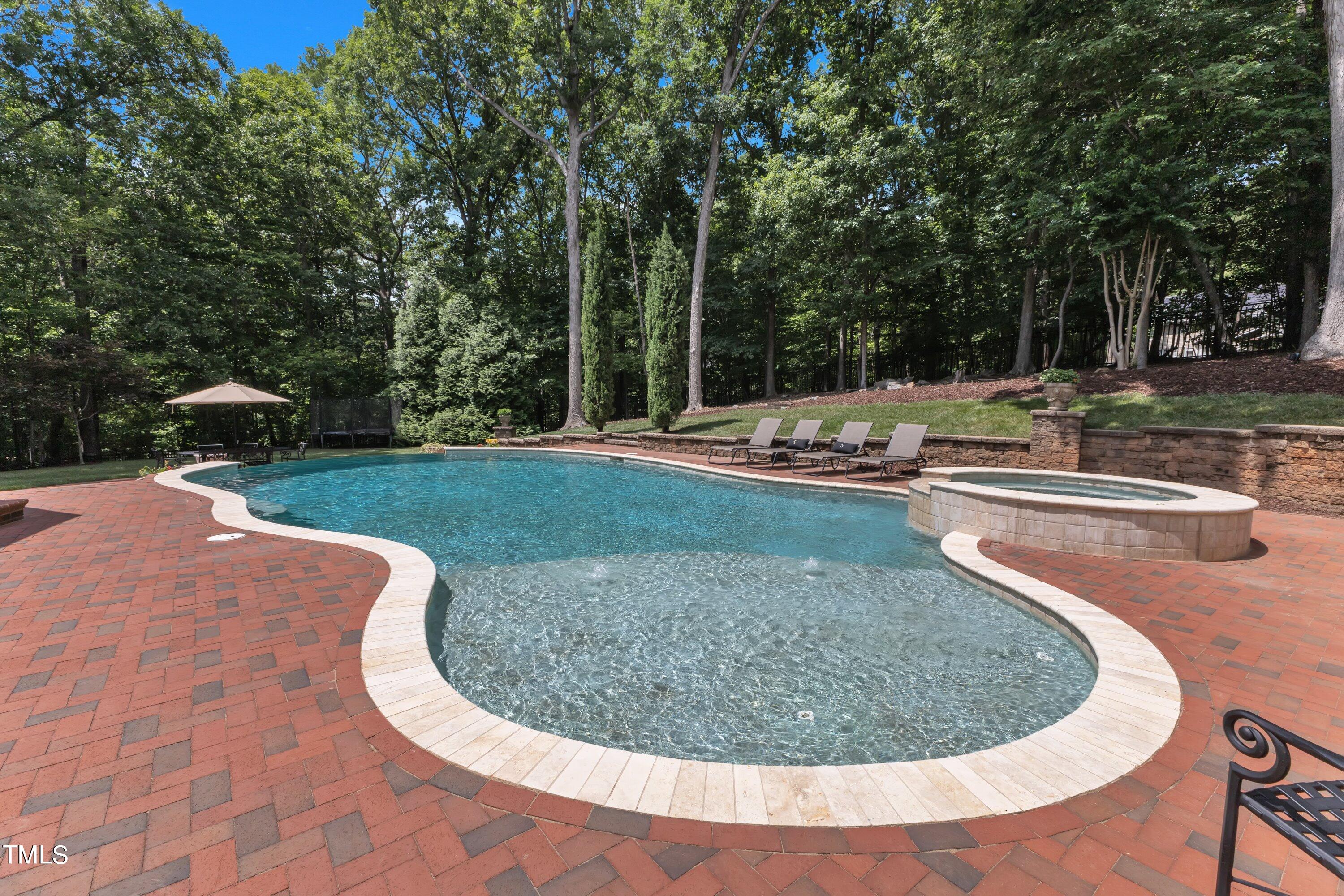 11220 Brass Kettle Road Raleigh, NC 27614 - Photo 68 of 86 a view of a swimming pool with a yard