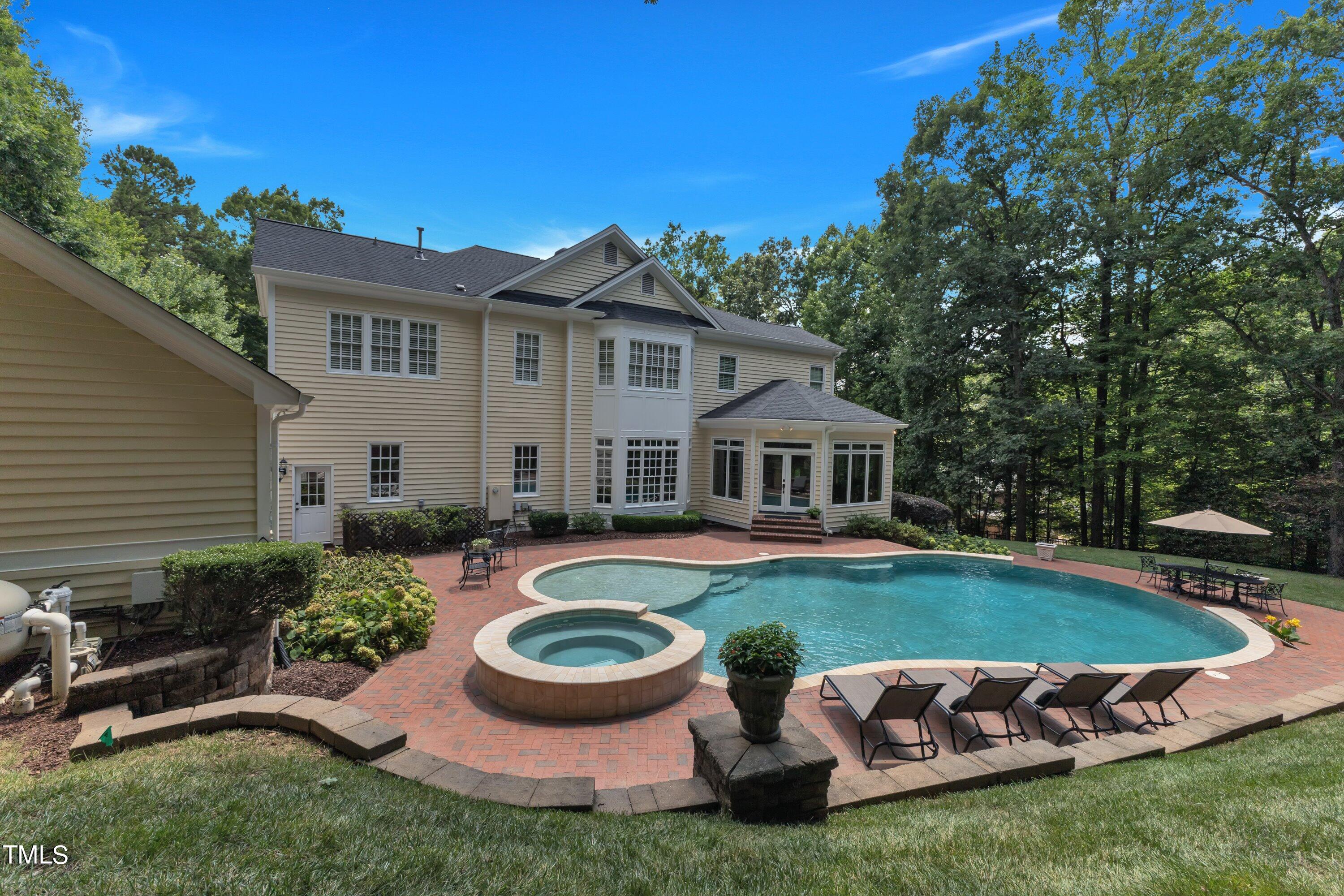 11220 Brass Kettle Road Raleigh, NC 27614 - Photo 74 of 86 a view of a house with backyard sitting area and swimming pool