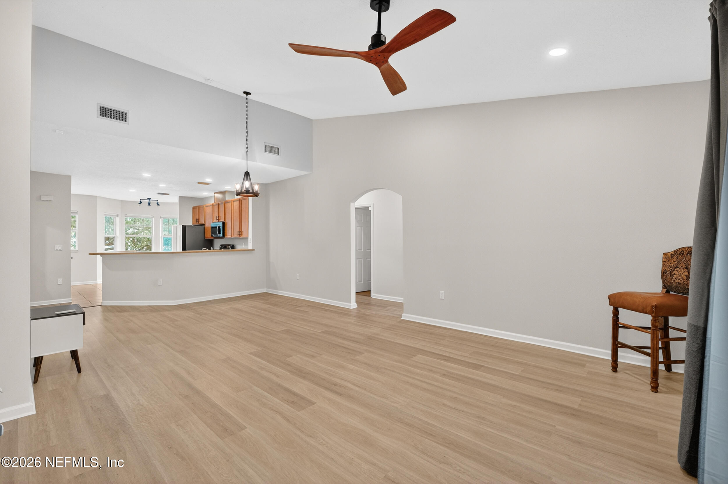 5663 Greenland Road, Unit 1304 Jacksonville, FL 32258 - Photo 14 of 41 a view of a room with wooden floor and windows