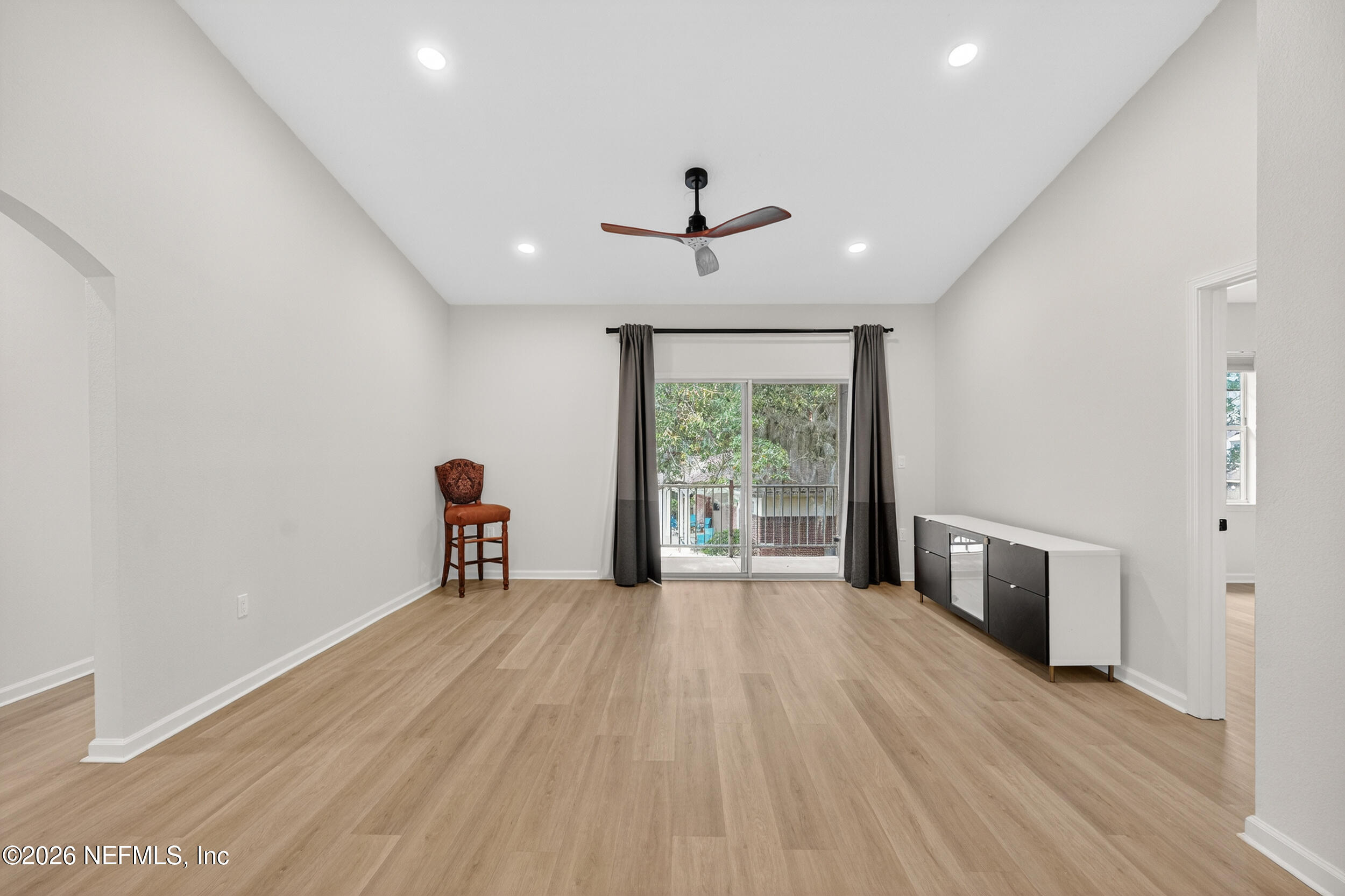 5663 Greenland Road, Unit 1304 Jacksonville, FL 32258 - Photo 16 of 41 a view of an empty room with a window and wooden floor