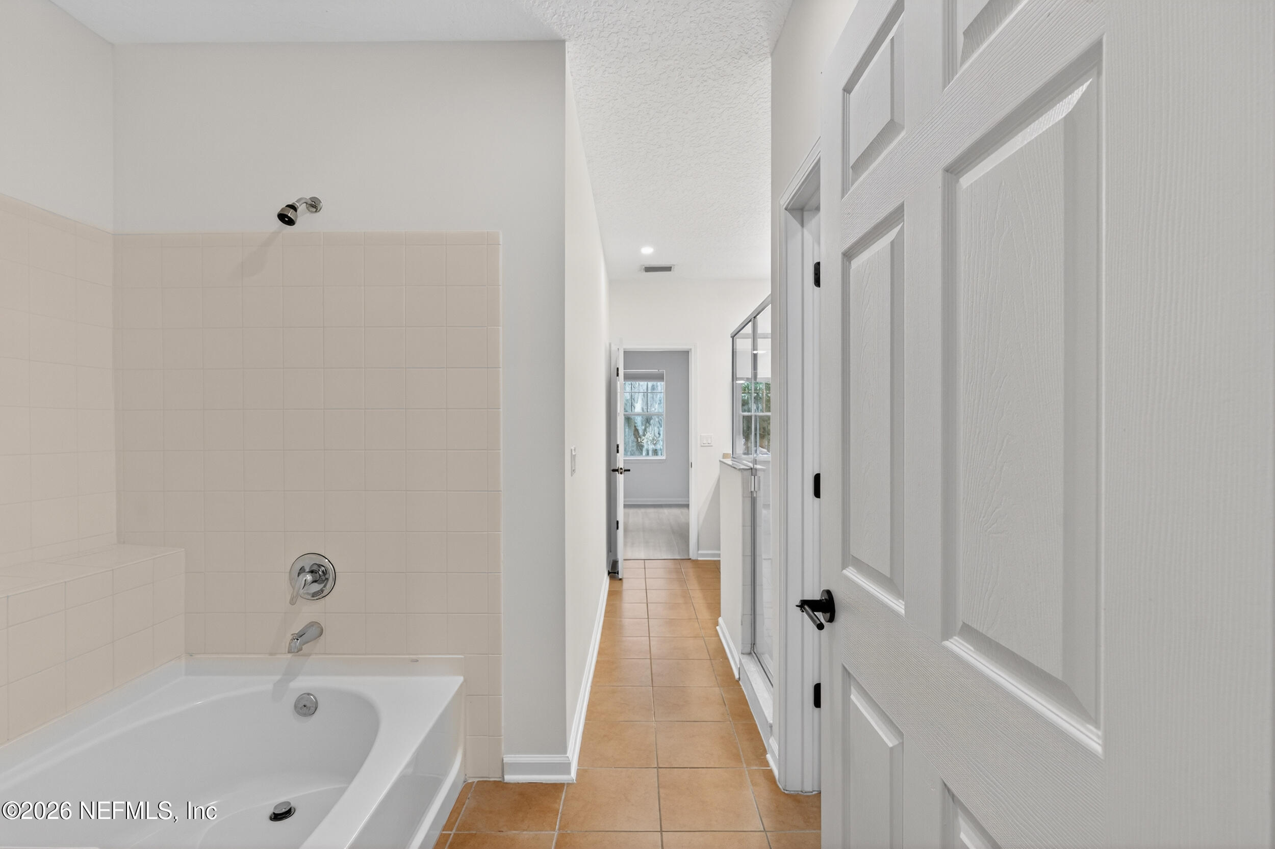 5663 Greenland Road, Unit 1304 Jacksonville, FL 32258 - Photo 24 of 41 a bathroom with a bathtub and a shower