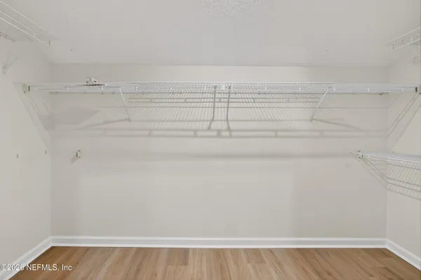 a view of a room with racks on the wall