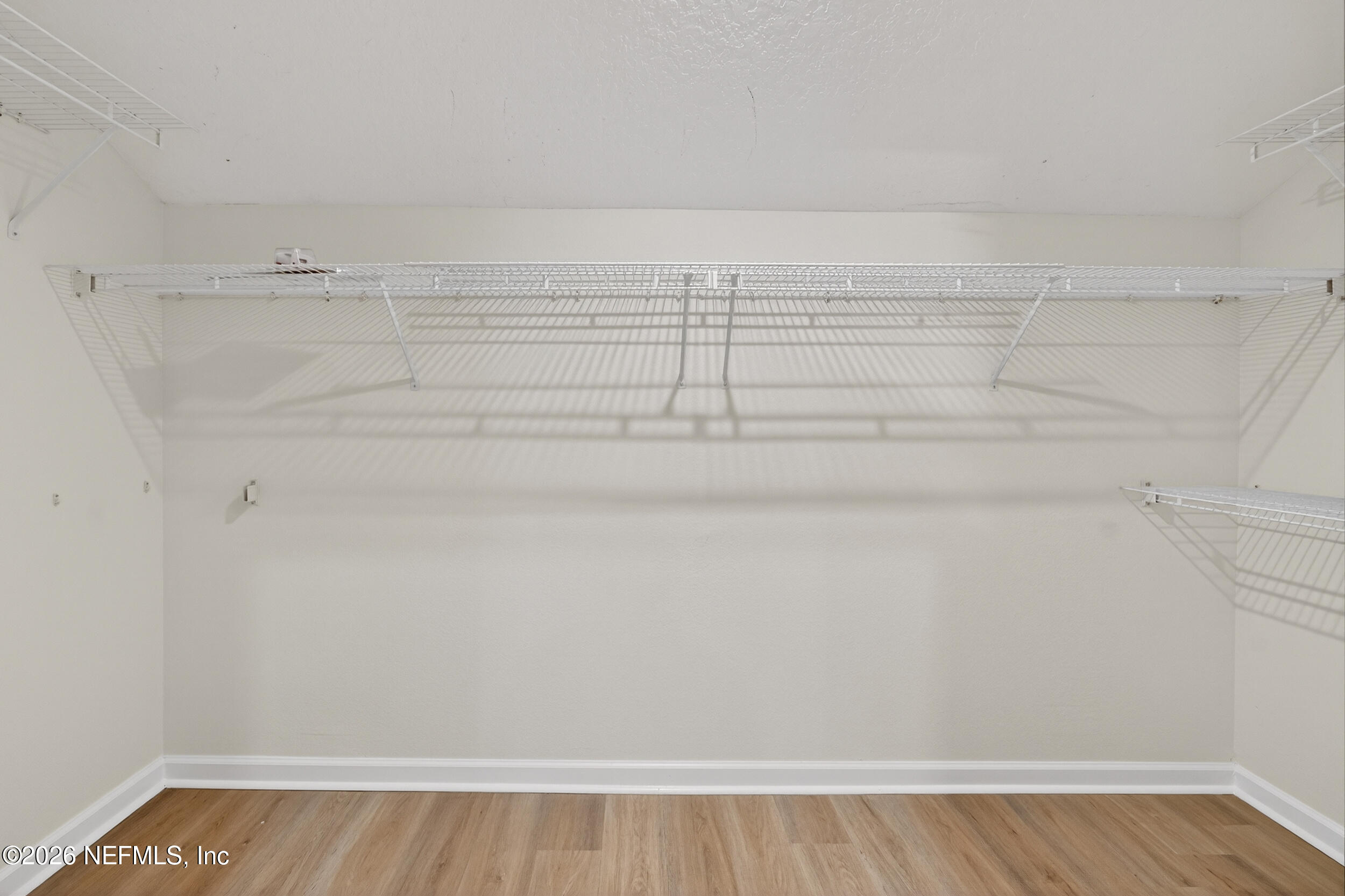 5663 Greenland Road, Unit 1304 Jacksonville, FL 32258 - Photo 26 of 41 a view of a room with racks on the wall