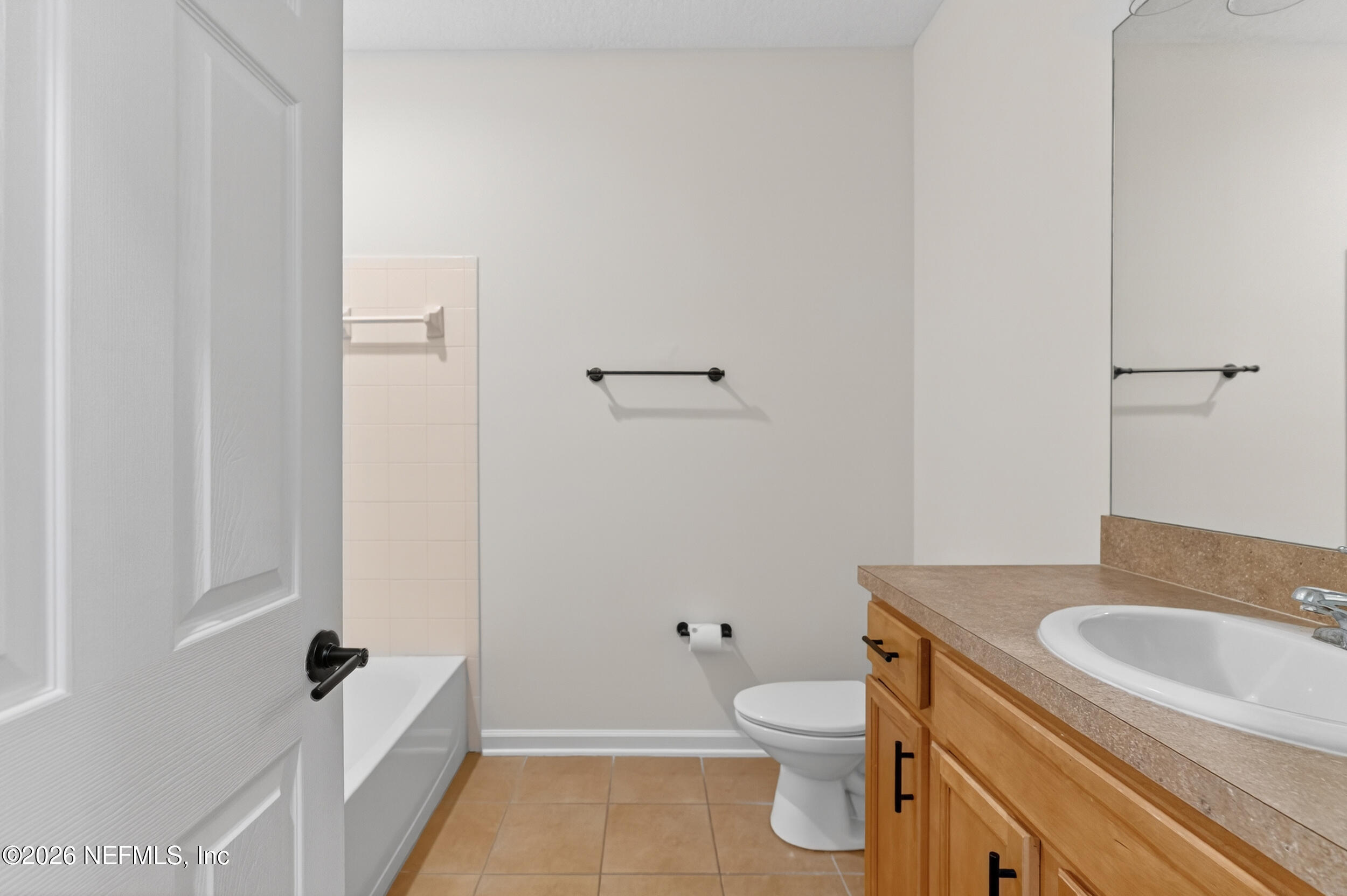 5663 Greenland Road, Unit 1304 Jacksonville, FL 32258 - Photo 30 of 41 a bathroom with a granite countertop sink toilet and shower