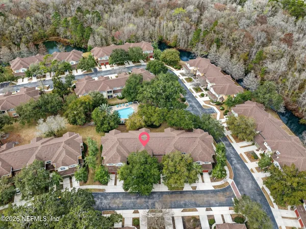 an aerial view of residential house with outdoor space
