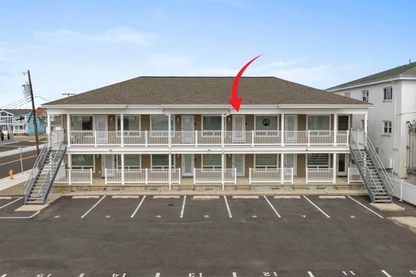 a front view of a building with a lot of windows