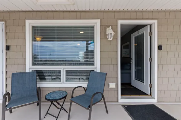 a view of dinning table and chairs in the porch